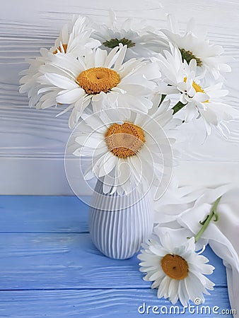 Chamomile bouquet shawl of a blossom design plant vase retro textile on a wooden arrangement background, fabric Stock Photo