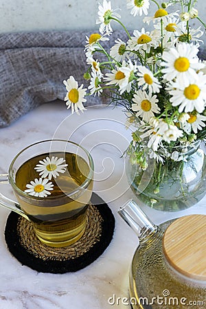 Chamomile tea. Herbal tea. Glass cup with warm fragrant chamomile tea Stock Photo