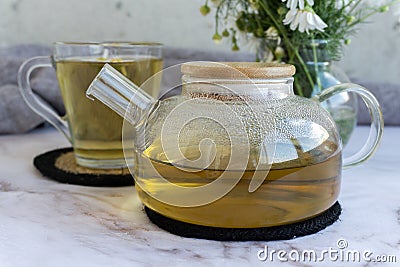 Chamomile tea. Herbal tea. Glass cup with warm fragrant chamomile tea Stock Photo