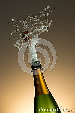 Cork Shooting Out Champagne Bottle Stock Photo
