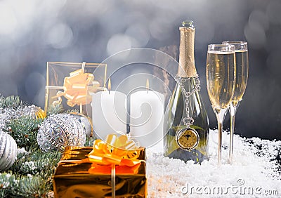 Champagne, Candles and Gifts in Festive Still Life Stock Photo