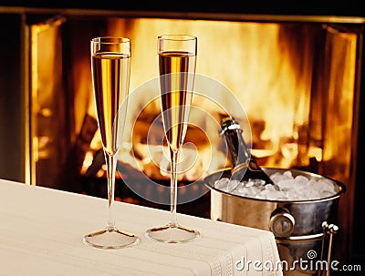 Champagne chilling by the fire Stock Photo
