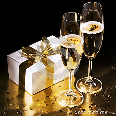 Champagne flutes with gift Stock Photo