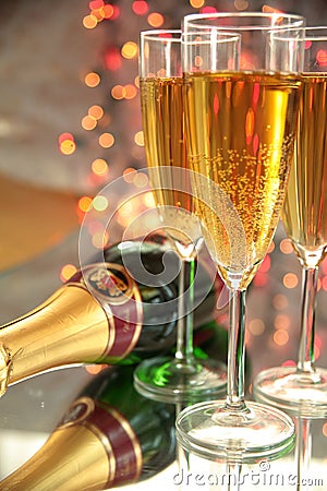 Champagne in glasses,bottle and blured lights Stock Photo