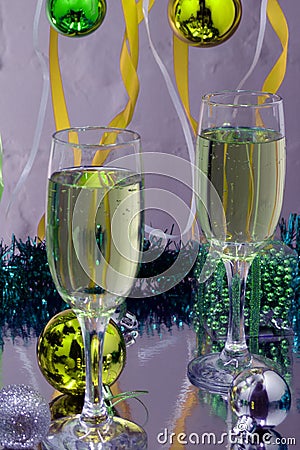 Champagne in glasses,gift boxes,candle lights and twinkle lights on background. Stock Photo