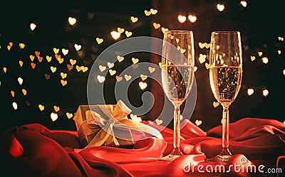 Champagne glasses on hearts bokeh background Stock Photo