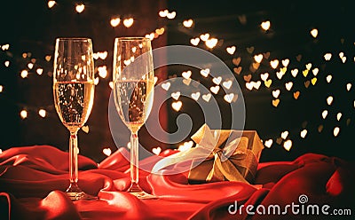 Champagne glasses on hearts bokeh background Stock Photo