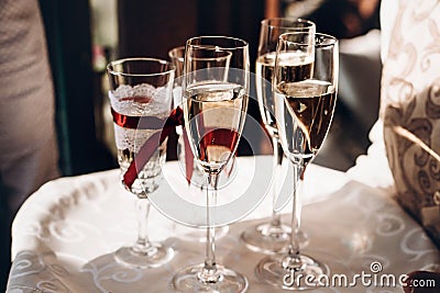 champagne glasses on tray at wedding reception, celebration outdoors, catering in restaurant. christmas and new year Stock Photo