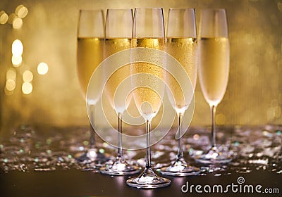 Champagne on gold background. Stock Photo