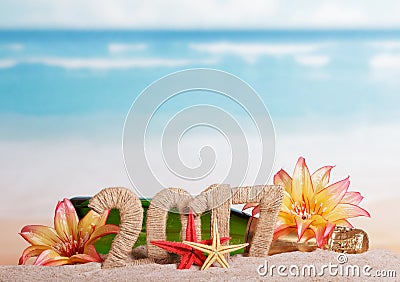 Champagne and the inscription 2017 in sand, decorated with tropical flowers on a background of sea Stock Photo