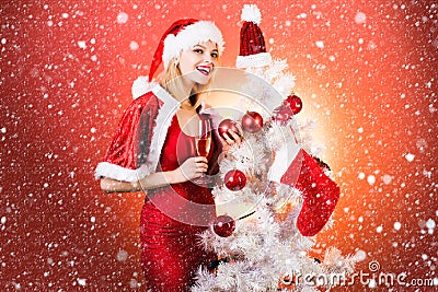 Christmas Girl - snow efects. Champagne new year party. Pretty girl wish merry Christmas and happy new year. Christmas Stock Photo