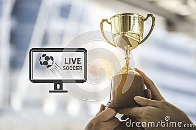 Champion golden trophy for winner background with live soccer sc Stock Photo