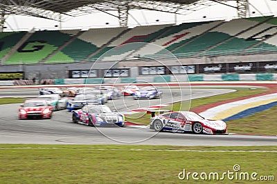 Champion Team Weider leads the pack into turn 2 Editorial Stock Photo