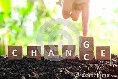 Chance to change, new opportunity, optimism and career growth concept. Male hand changing or flipping word chance to change wooden Stock Photo