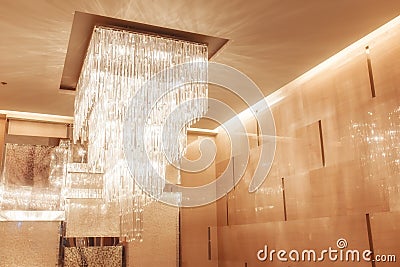 Chandelier with warm and vintage tone for interiors design. Stock Photo