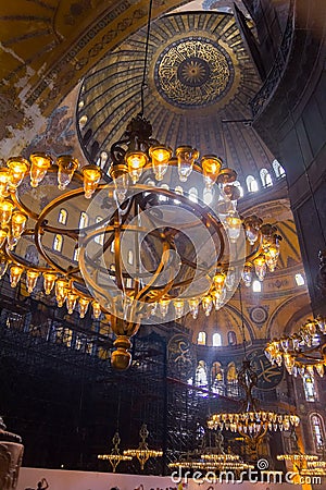 Chandeliers, domes and murals in magnificent and beautiful famous Hagia Sophia mosque Editorial Stock Photo