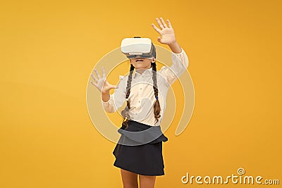 Changing digital experiences way we learn and create. Digital virtual future and innovation. Little child in VR headset Stock Photo