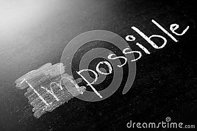 Changing impossible into possible on a chalkboard Stock Photo