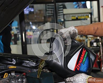 Changing motor oil and maintainance car engine at car station Stock Photo