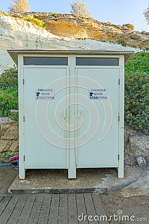 Changing rooms for changing into and taking off bathing suits and foot washing facilities and showers on Malama beach in Kapparis Editorial Stock Photo