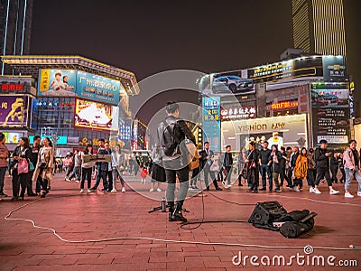 Unacquainted street performers singing at huangxing walking street in Changsha city China Editorial Stock Photo