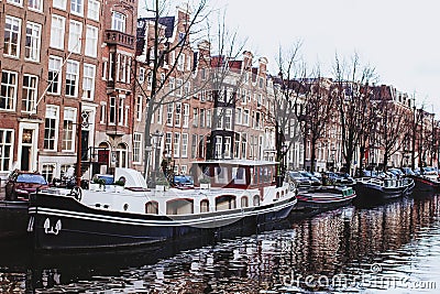 Channel in Amsterdam Netherlands Boat houses river european city landscape Stock Photo