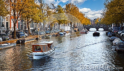 Channel in Amsterdam Netherlands Holland houses under river Stock Photo