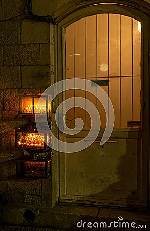 Chanuka lights on old jerusalem city street Stock Photo