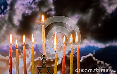 Chanukah Menorah in the Jewish festival of lights beautiful sky with cloud sunset Stock Photo