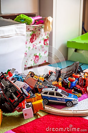 Chaos in the colorful children`s room - Toy cars. Stock Photo