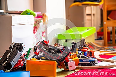 Chaos in the colorful children`s room - Toy cars. Stock Photo