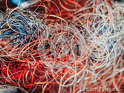 Chaotically tangled threads. Embroidery threads randomly woven. Huge knot. Extreme macro. Beautiful story for intro. Title credits Stock Photo