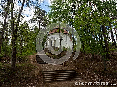 Chapel being part of the Way of the Cross, surrounded by the forest. Stock Photo