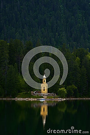 chapel built in a wooded area on the lake Stock Photo