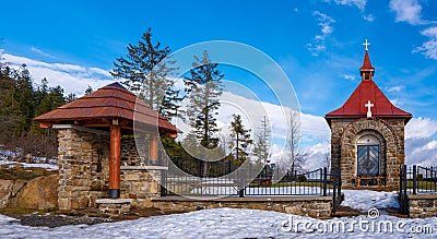 Chapel in the mountains for occasional worship with benches in winter beautiful suns day, czech beskydy , polomy Stock Photo