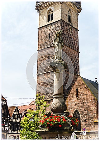 Chapel of Virgin, the Belfry and colonne with the statue of Saint Odile Editorial Stock Photo