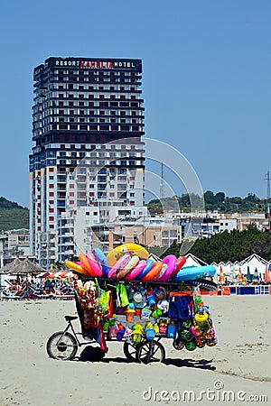 Toys seller cart with plastic toys and beach balls on the sandy beach Editorial Stock Photo