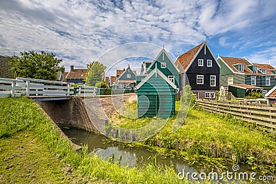 Characteristic Dutch village scene with wooden houses and bridge Stock Photo