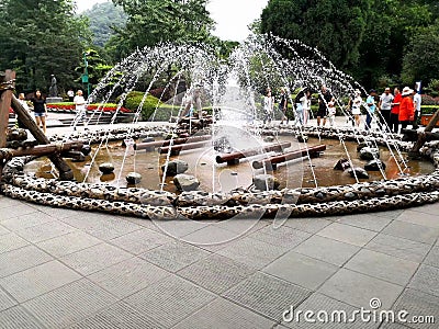 Characteristic Fountain surrounded by hand-woven stone cages Editorial Stock Photo