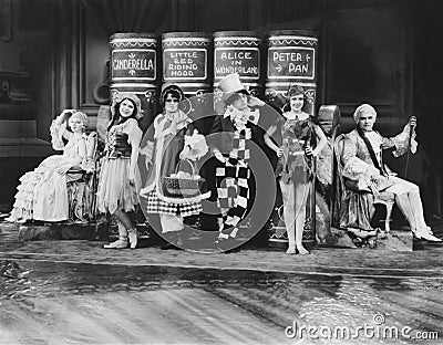 Characters from childrens stories posing with their books Stock Photo