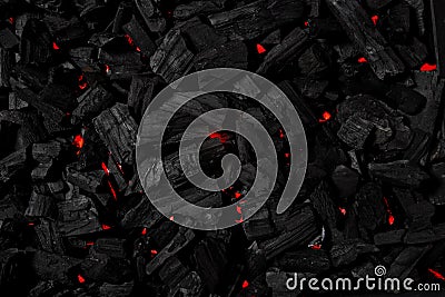 Charcoal background illuminated with red light underneath Stock Photo