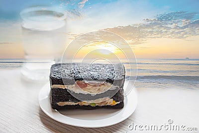 Charcoal sandwiches with sunrise on the beach. Stock Photo