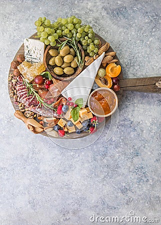 Charcuterie board. Cheese platter. Assortment of tasty appetizers or antipasti. Top view. Copy space Stock Photo