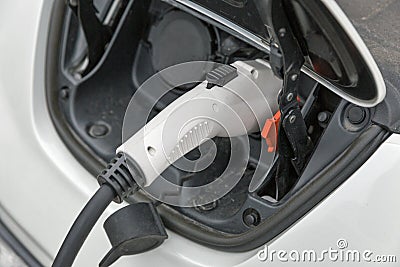 Charging an electric car closeup Stock Photo