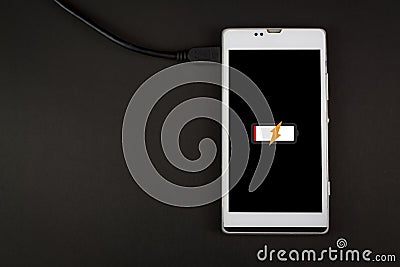 Charging smartphone on background Stock Photo