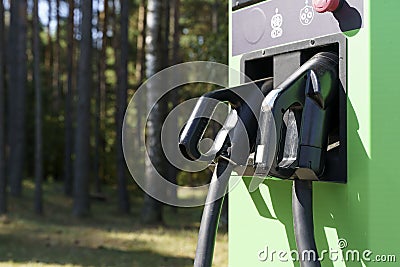 Charging station for electric cars. Types and connectors of ports for charging vehicles. Stock Photo