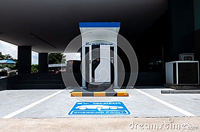 Charging station for electric vehicle.outdoor car parking . blue sign EV quick charging point Editorial Stock Photo