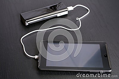 Charging tablet Stock Photo