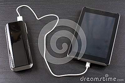 Charging tablet Stock Photo