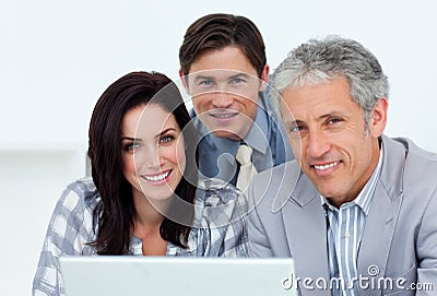 Charismatic business people working at a computer Stock Photo